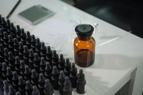Brown bottle next to bottles Stock Photos