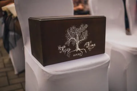 A brown box for gift envelopes painted with white paints Stock Photos
