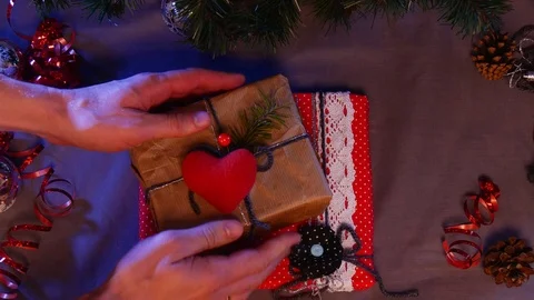 A Brown Box With a Red Heart on it is Taken Away, and a Spotted Red Box With Stock Footage 72889826