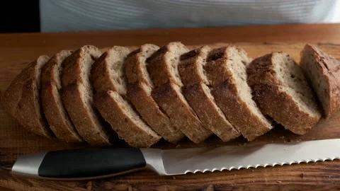 Brown bread cut in slices Stock Footage 137447366
