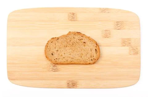 Brown bread slice on bamboo board Stock Photos