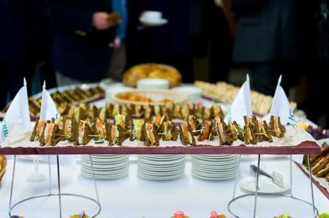Brown bread snacks on a buffet table on the background of other snacks Stock-Fotos