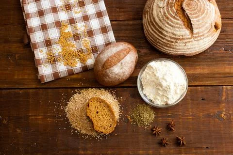 Brown bread on the wooden table Stock Photos