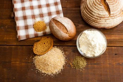 Brown bread on the wooden table Stock Photos