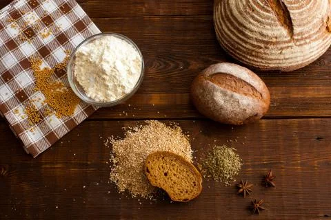 Brown bread on the wooden table Stock Photos