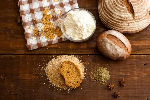 Brown bread on the wooden table Stock Photos