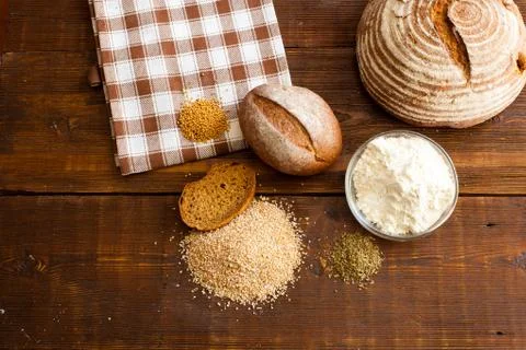 Brown bread on the wooden table Stock Photos