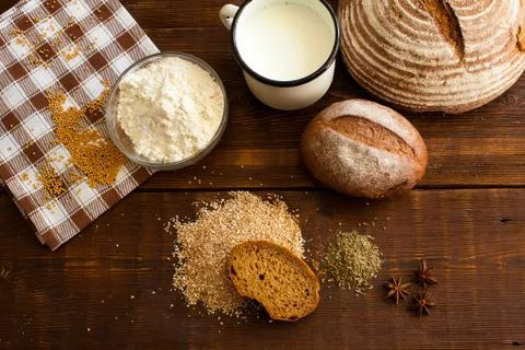 Brown bread on the wooden table Stock Photos