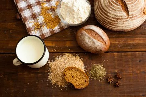 Brown bread on the wooden table Stock Photos