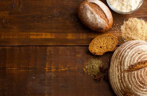 Brown bread on the wooden table Stock Photos