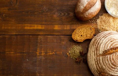 Brown bread on the wooden table Stock Photos