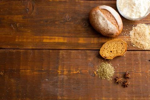 Brown bread on the wooden table Stock Photos