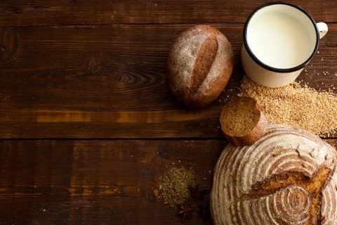 Brown bread on the wooden table Stock Photos