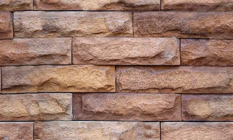 Brown brick background. Stone seamless pattern Stock Photos