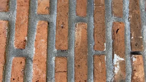 Brown brick texture wall. Old stained brick wall with unique Stock-Fotos