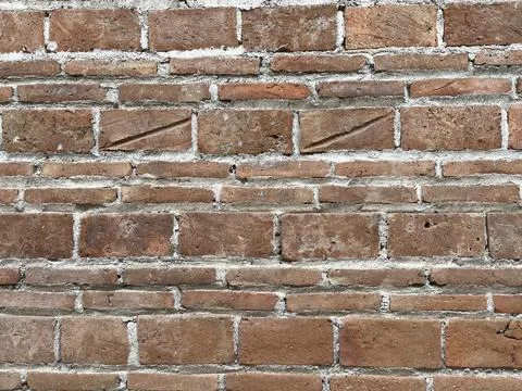Brown brick texture wall. Old stained brick wall with unique Stock Photos
