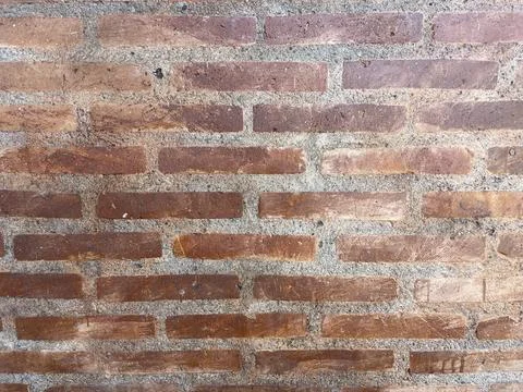 Brown brick texture wall. Old stained brick wall with unique Stock Photos