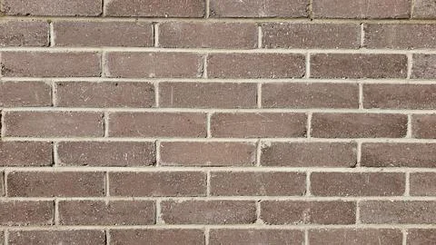 Brown brick wall, abstract background texture. Stock Photos