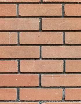 Brown brick wall close up seamless background, space for text 写真素材