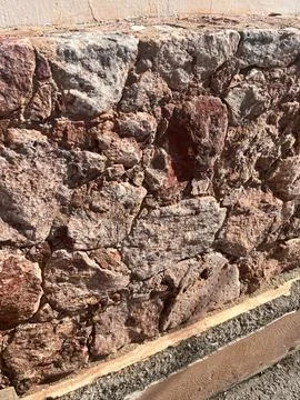 Brown brick wall in the sun Stock Photos