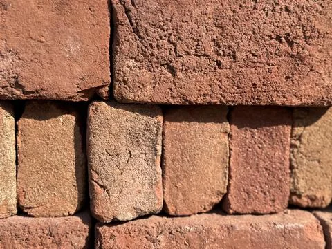 Brown brick wall texture with rough surfaces, perfect for architectural bac.. Photos