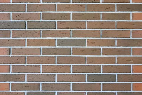 Brown brick wall texture with white grout 스톡 사진