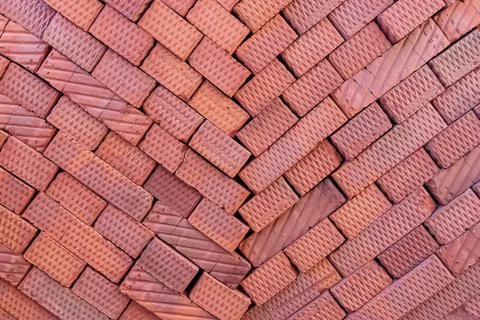Brown bricks folded into a pile, a background from bricks. Stock Photos