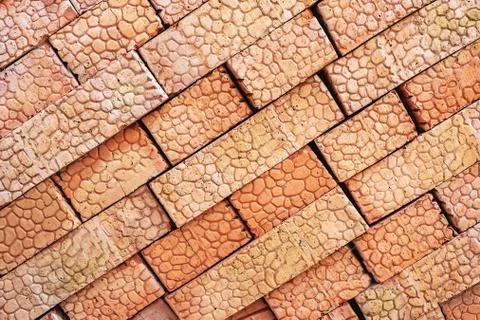 Brown bricks folded into a pile, a background from bricks. Stock Photos