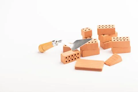 Brown bricks on a white background. Construction Materials Stock Photos