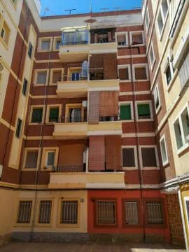 Brown building with roller blinds Stock Photos