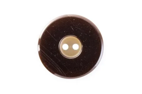 Brown button on a white background Stock Photos