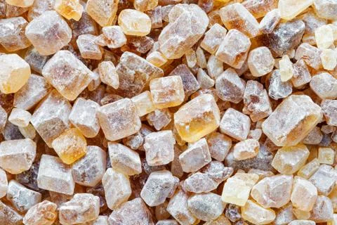 Brown cane sugar background. Stock Photos