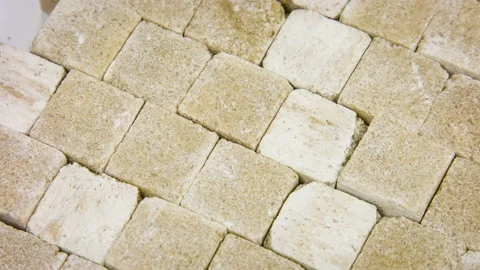 Brown cane sugar cubes background close-up rotation Stock Footage 89820497