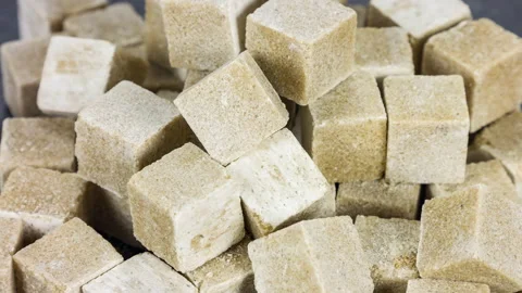Brown cane sugar cubes close up rotation Stock-Footage 89781946