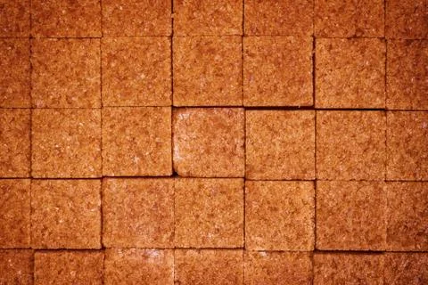 Brown cane sugar cubes macro texture Foto stock