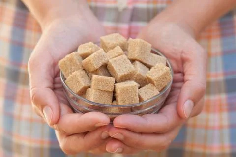 Brown cane sugar Stock Photos