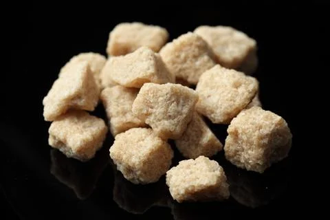 Brown cane sugar Stock Photos