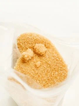 Brown cane sugar Stock Photos