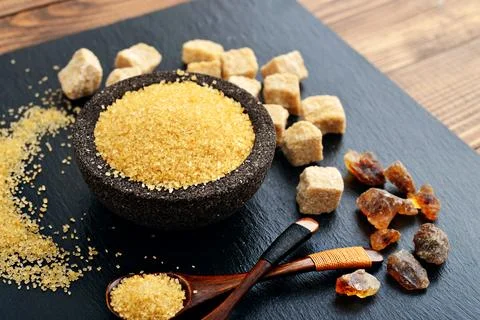Brown cane sugar Stock Photos