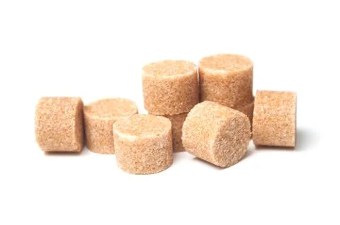 Brown cane sugar in shaped circle on white background Foto stock