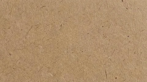 Brown cardboard texture background closeup. Fotos Stock