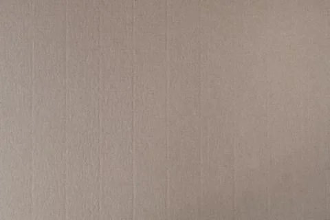 Brown cardboard with a texture on the surface .Texture or background Stock Photos