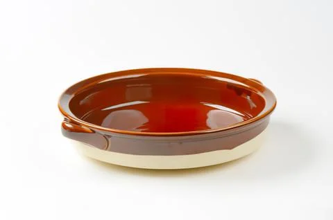 Brown ceramic baking dish with two handles Stock Photos