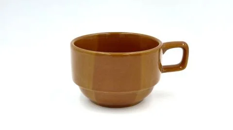 Brown ceramic cup on isolated white Stock Photos