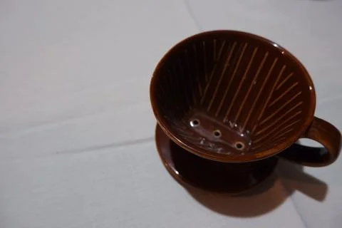 Brown Ceramic Pour-Over Coffee Dripper on White Background Stock Photos