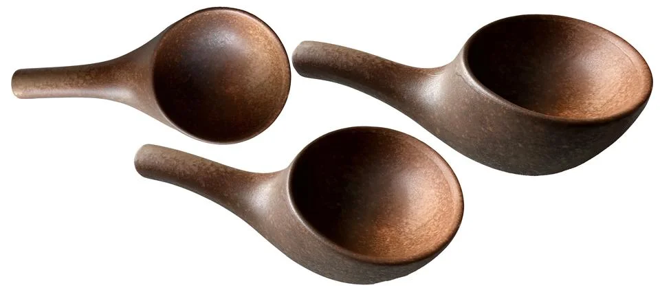 Brown ceramic spice container, ceramic gravy boat, salad bowl. Stock Photos