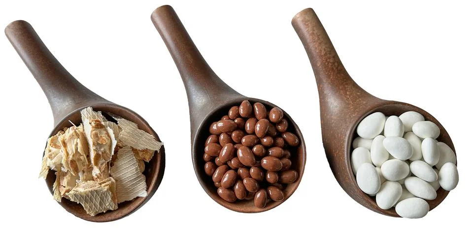 Brown ceramic ware for sweets with nuts in milk chocolate and white chocola.. Stock Photos