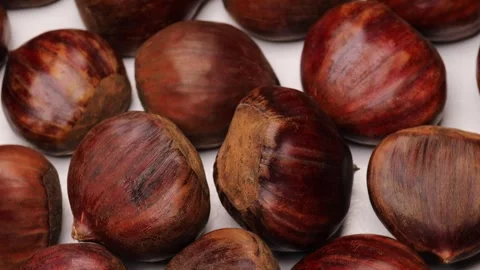 Brown chestnuts, rotation in circle. Chestnuts show natural texture and glo.. Stock Footage 318902359