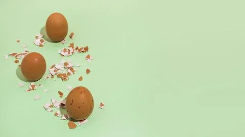 Brown chicken eggs with broken shell green table Stock Photos