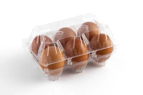 Brown chicken eggs in  a plastic package on white background.6  pieces brown  Stock Photos